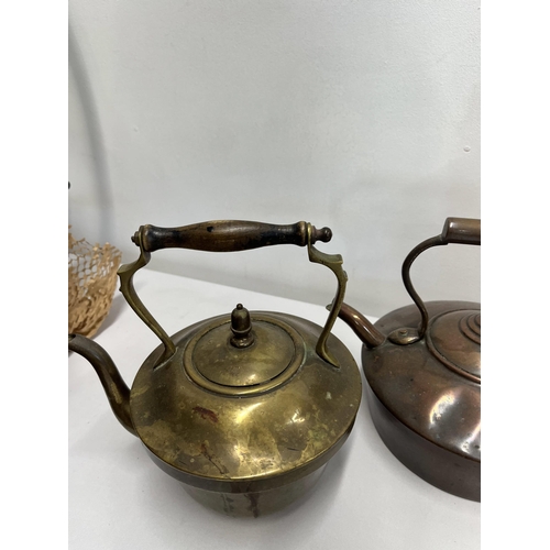 71 - An assortment of brass and copperware items to include chargers, kettles, buckets, jam pan etc.