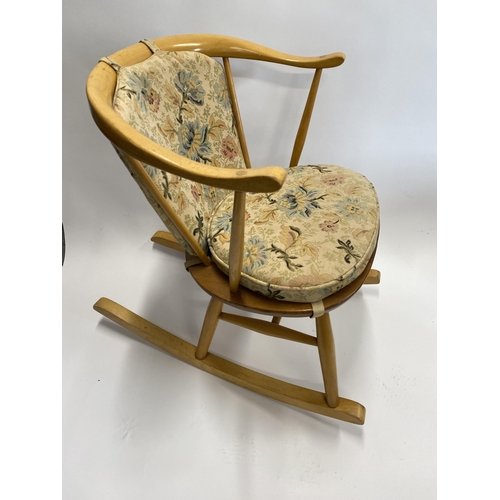 110 - Child's Ercol rocker chair with tapestry design to seat, gold Ercol label to underside