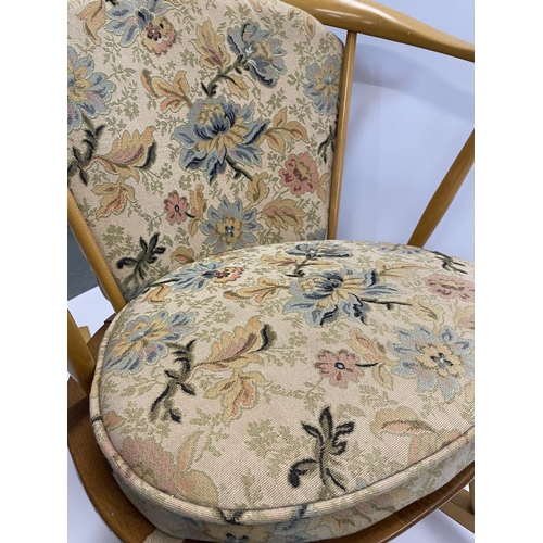 110 - Child's Ercol rocker chair with tapestry design to seat, gold Ercol label to underside