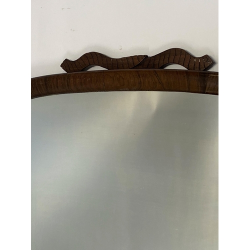 24 - A vintage mirror in a shield style design wooden trim, approx. L 68cm X W 55cm