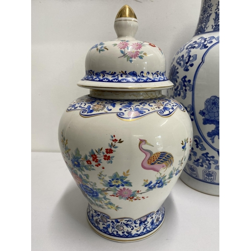 257 - Group of oriental vases to include a blue and white vase depicting peacocks and flowers, vase depict... 