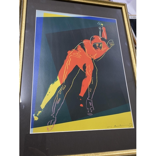 273 - Two framed prints of male form, one featuring speed skater by Andy Warhol