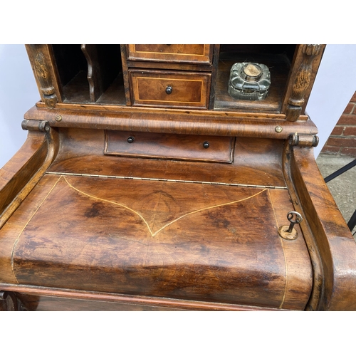 33 - Davenport style desk with drawers with inlaid trim, carved panel detailing, glass inkwell and key, a... 