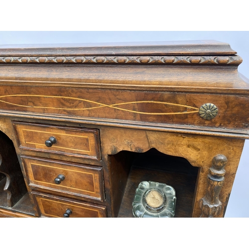 33 - Davenport style desk with drawers with inlaid trim, carved panel detailing, glass inkwell and key, a... 