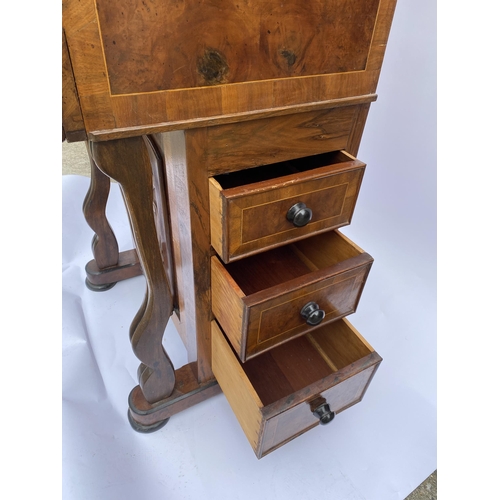 33 - Davenport style desk with drawers with inlaid trim, carved panel detailing, glass inkwell and key, a... 