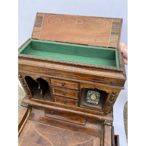 33 - Davenport style desk with drawers with inlaid trim, carved panel detailing, glass inkwell and key, a... 