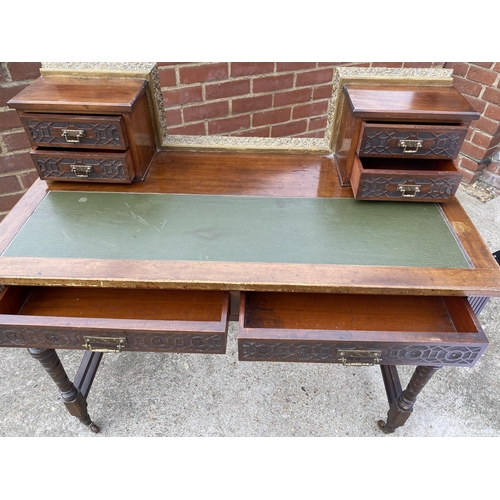 41 - Regency style leather topped desk with brass balustrade to the top drawers, on castors, W107cm xD 56... 