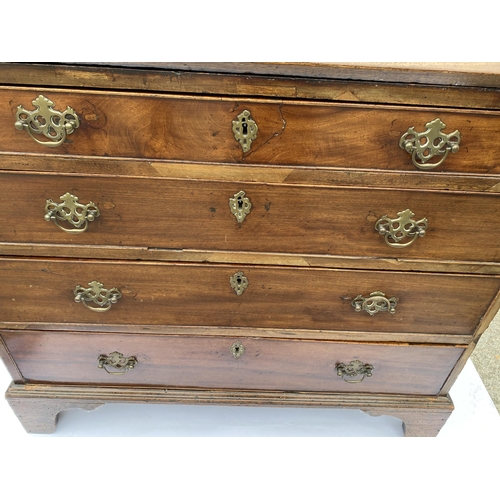 42 - Antique mahogany four drawer bureau, the drop-down front reveals smaller drawers and highly decorati... 