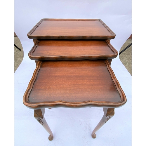 47 - Bevan Funnell mahogany nest of three tables with raised edge design, approx. max height 55cm