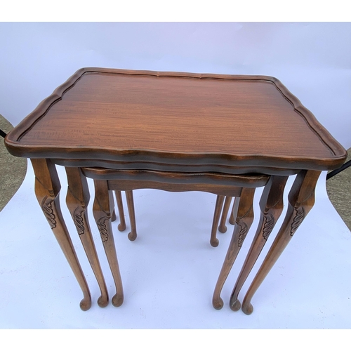 47 - Bevan Funnell mahogany nest of three tables with raised edge design, approx. max height 55cm