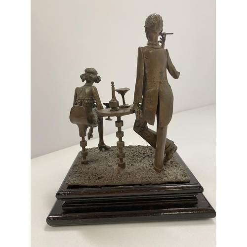 76 - A bronze hand sculpture of 1920s party scene on wooden base, approx. overall max height 20cm