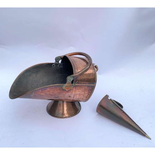 85 - A copper/brass helmet shaped coal scuttle together with a copper conical ale muller / beer warmer