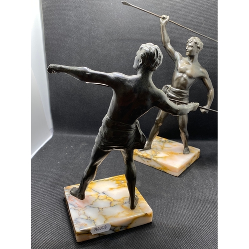 84 - Two bronzed warrior figures on marble plinths