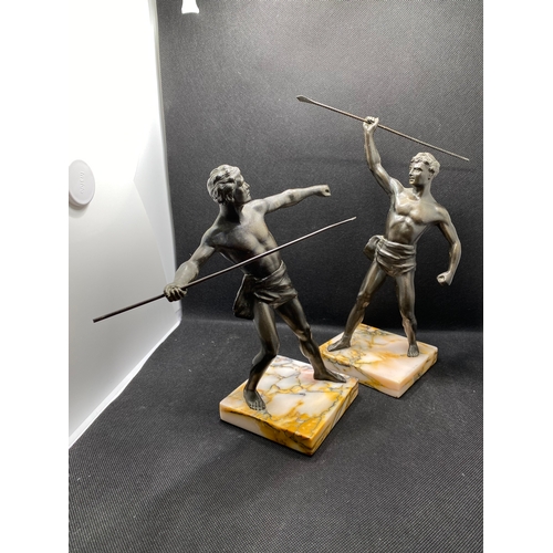 84 - Two bronzed warrior figures on marble plinths