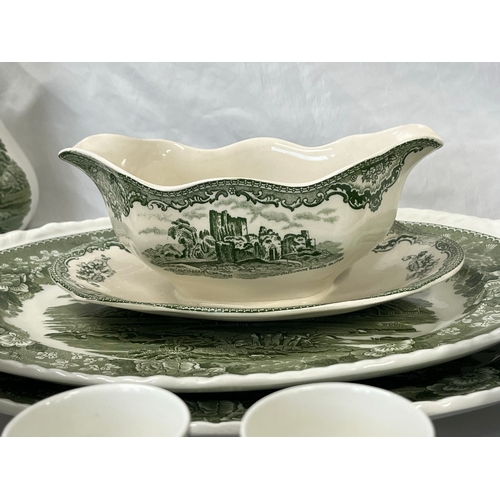 81 - A large quantity of Adams real English ironstone china depicting English countryside scene, terrines... 