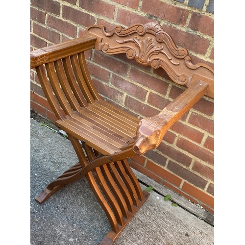 108 - A solid folding hardwood chair with Foo dog style handles