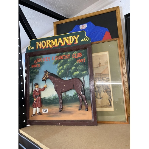 243 - A vintage jockey silks label reading Waterfall Newmarket in wooden frame, approx. frame size H 81cm ... 