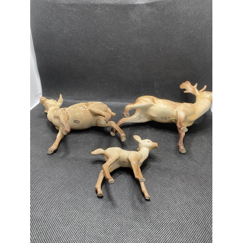 269 - Group of three Beswick deer family