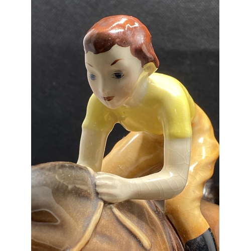 271 -  Beswick hand painted ceramic model of a lady jockey in yellow shirt jumping a fence, makers mark to... 