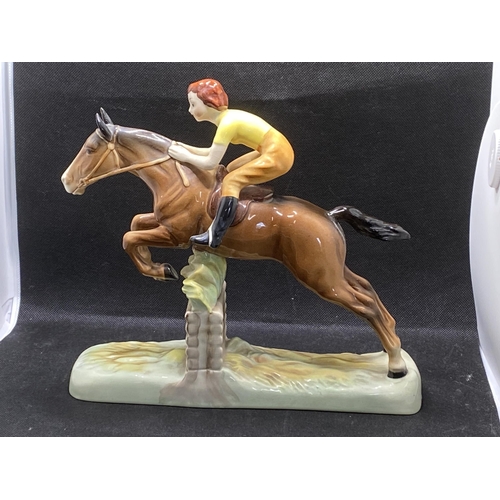 271 -  Beswick hand painted ceramic model of a lady jockey in yellow shirt jumping a fence, makers mark to... 