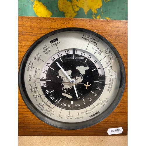 250 - A wood mounted world clock (purchased from Harrods), with a vintage world map for the radio amateur ... 