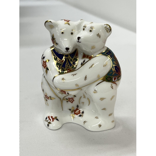 189 - Bear hug Royal Crown Derby paperweight with no stopper in box together with Royal Crown Derby panda ... 