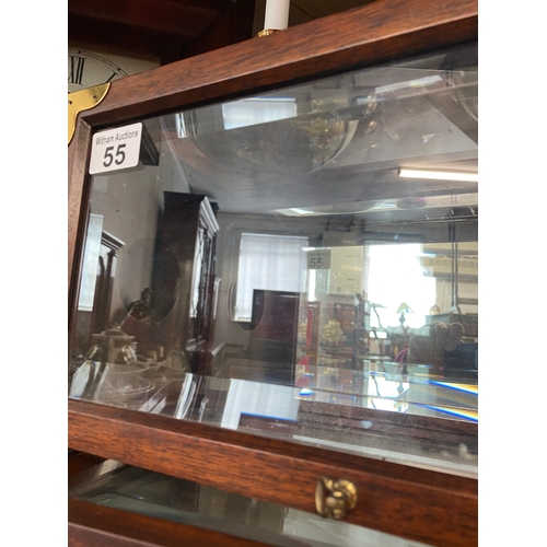 55 - A pair of wall hung mahogany cases with bevelled glass panels and removable brass coloured candle ho... 