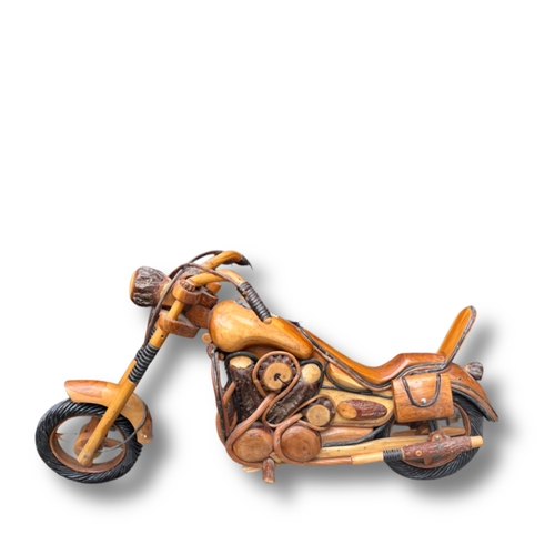 124 - A quirky lacquered wooden motorcycle with moving wheels and handles