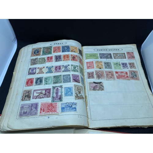 157 - The Globe stamp album, containing stamps from around the world together with a Strand stamp album to... 