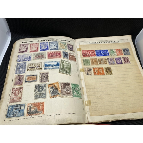 157 - The Globe stamp album, containing stamps from around the world together with a Strand stamp album to... 