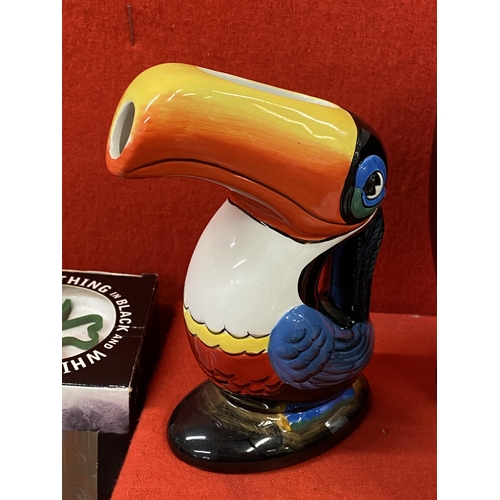 39 - Guinness memorabilia items to include a ceramic Toucan jug, postcards, pint glasses, a Gilroy and Ru... 