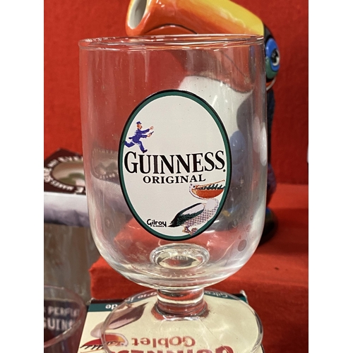 39 - Guinness memorabilia items to include a ceramic Toucan jug, postcards, pint glasses, a Gilroy and Ru... 