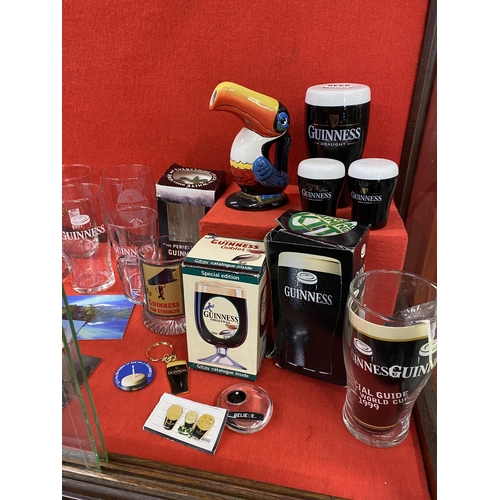 39 - Guinness memorabilia items to include a ceramic Toucan jug, postcards, pint glasses, a Gilroy and Ru... 