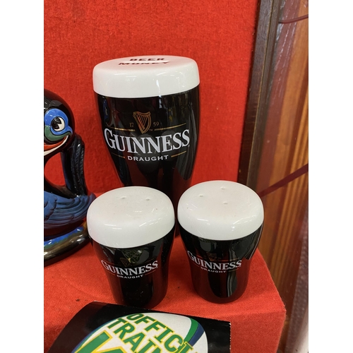 39 - Guinness memorabilia items to include a ceramic Toucan jug, postcards, pint glasses, a Gilroy and Ru... 