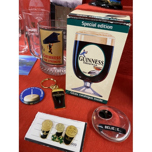 39 - Guinness memorabilia items to include a ceramic Toucan jug, postcards, pint glasses, a Gilroy and Ru... 