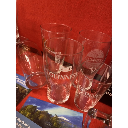 39 - Guinness memorabilia items to include a ceramic Toucan jug, postcards, pint glasses, a Gilroy and Ru... 