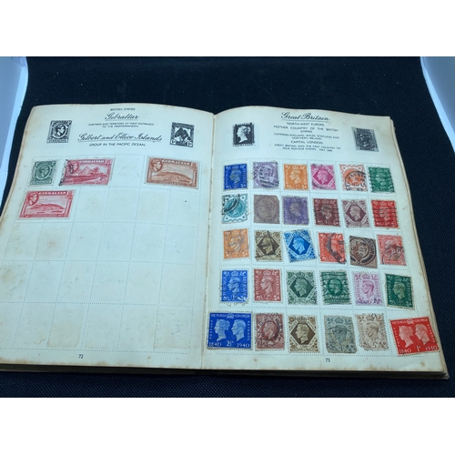 155 - A hardback - The Nelson stamp album, in excess of 135 pages full/part filled with stamps from variou... 