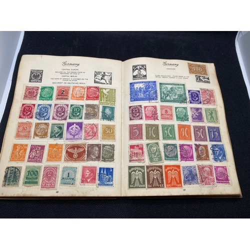 155 - A hardback - The Nelson stamp album, in excess of 135 pages full/part filled with stamps from variou... 