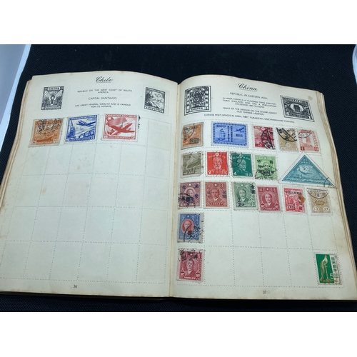 155 - A hardback - The Nelson stamp album, in excess of 135 pages full/part filled with stamps from variou... 