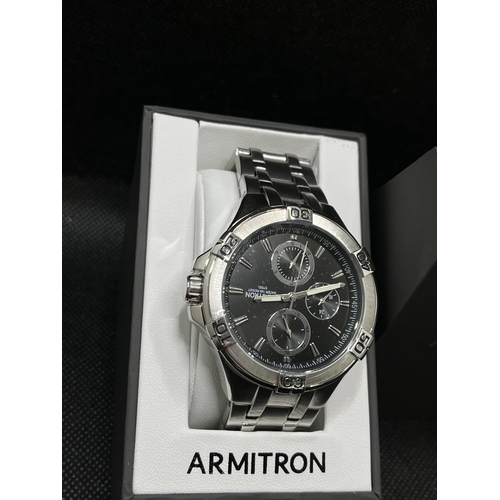 53 - An Armitron gent's silver and black wristwatch, as new with box,  with proof of purchase