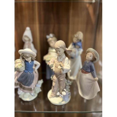 102 - A selection of Lladro and Nao figurines, x13 items in total A/F