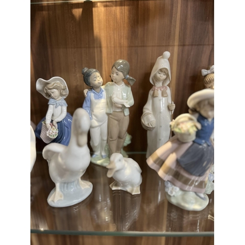 102 - A selection of Lladro and Nao figurines, x13 items in total A/F