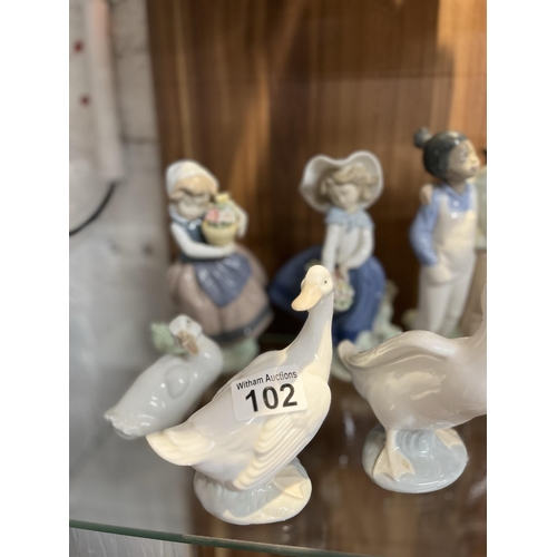 102 - A selection of Lladro and Nao figurines, x13 items in total A/F