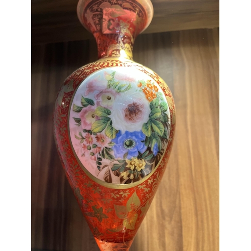 103 - Cranberry vase with hand painted portrait and gold gilt design of flowers, approx height 30cm