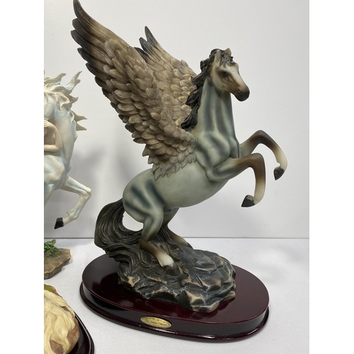 125 - Fairy and Unicorn figurine with box approx. H28cm, together with two other resin figures