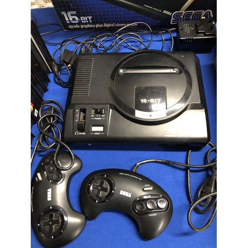 142 - Sega Mega Drive 16 bit arcade graphics plus digital stereo sound console in original box, with 12 ga... 