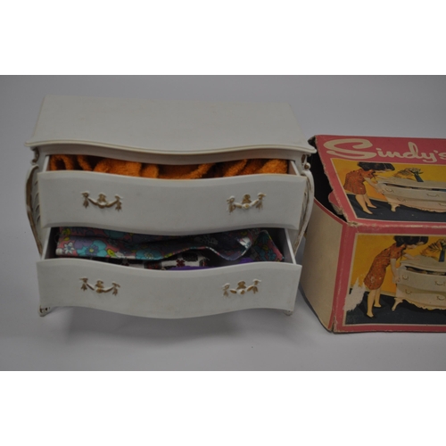 174 - A selection of Sindy furniture items, predominantly boxed items to include; sideboard, bed and bedcl... 