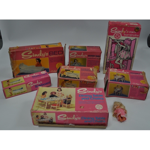 174 - A selection of Sindy furniture items, predominantly boxed items to include; sideboard, bed and bedcl... 