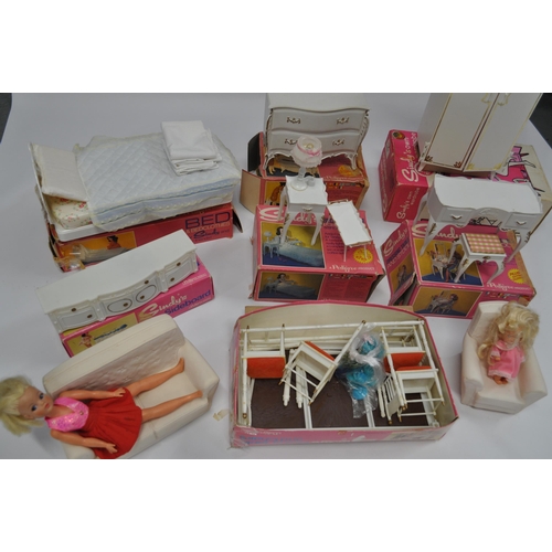 174 - A selection of Sindy furniture items, predominantly boxed items to include; sideboard, bed and bedcl... 