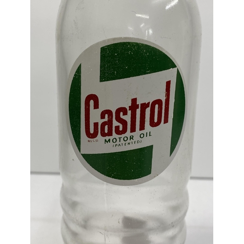 206 - A Castrol Motor Oil glass bottle with label in good condition.